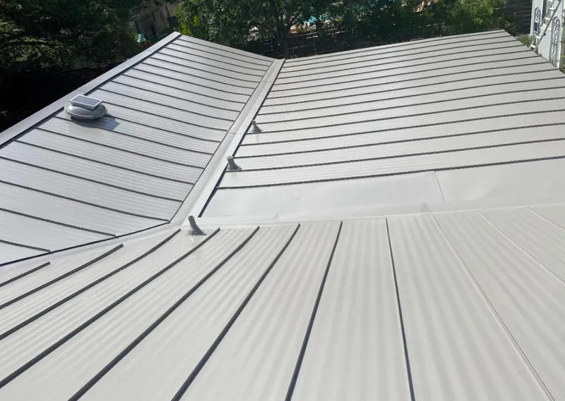 Solar attic fan installed on a metal roof for Roof Ventilation in Crawfordville